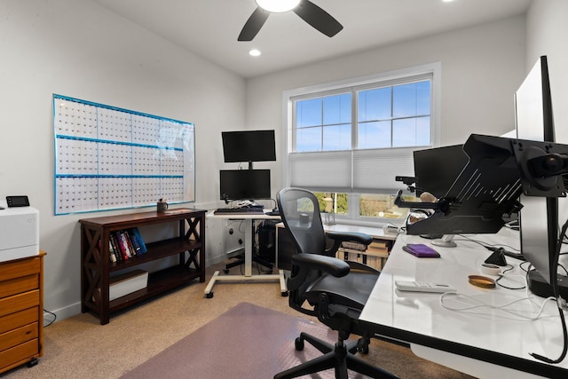 office space featuring recessed lighting, ceiling fan, baseboards, and light colored carpet