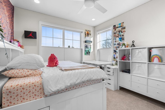 bedroom with light carpet, a ceiling fan, and recessed lighting