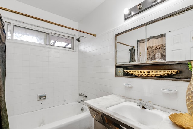 bathroom featuring backsplash, shower / bath combination with curtain, and vanity