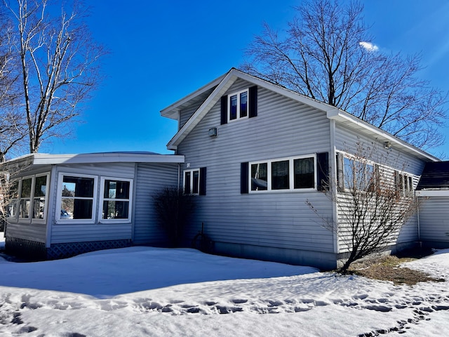 view of snow covered house