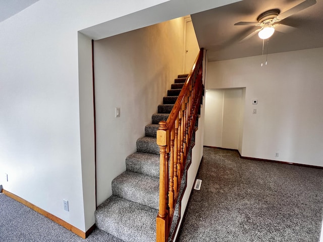 stairs with carpet flooring, ceiling fan, and baseboards