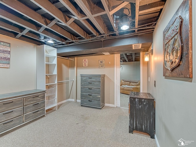 finished basement featuring carpet floors and baseboards