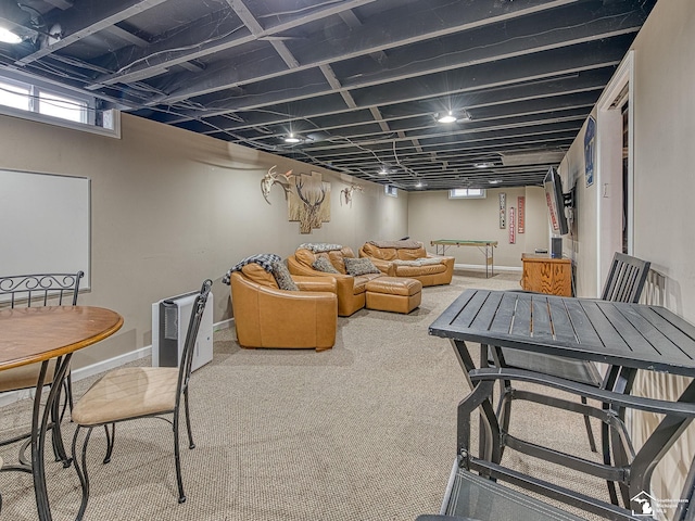 interior space featuring carpet flooring and baseboards