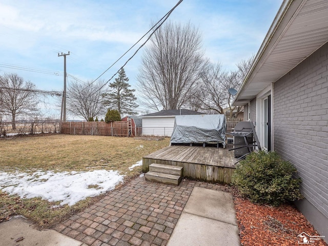 view of yard with a deck and a fenced backyard