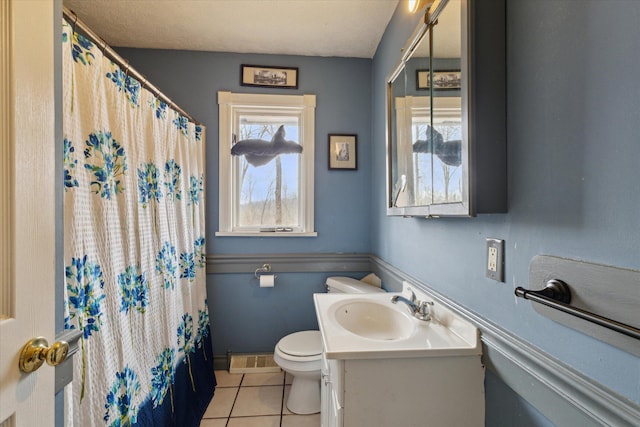 bathroom with visible vents, a shower with shower curtain, toilet, tile patterned flooring, and vanity