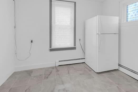 interior space featuring baseboard heating