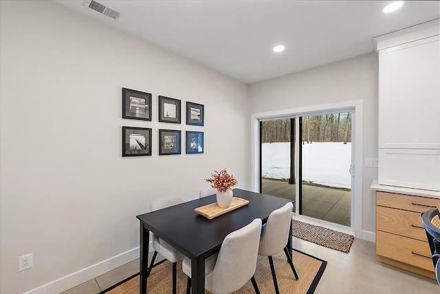 dining space with baseboards, visible vents, and recessed lighting