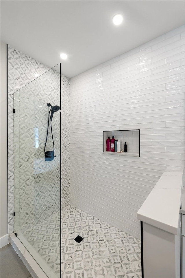 bathroom with recessed lighting and a walk in shower