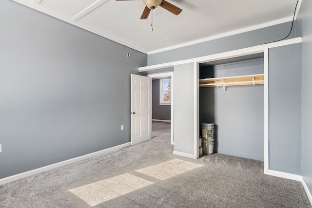 unfurnished bedroom with ceiling fan, baseboards, a closet, and light colored carpet