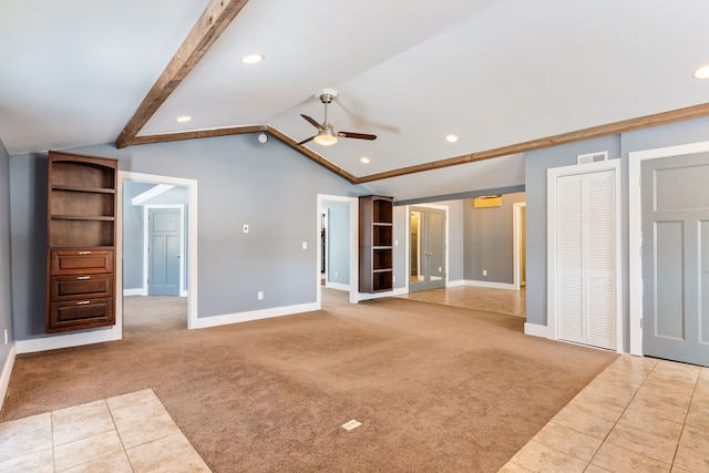 unfurnished living room featuring light tile patterned floors, lofted ceiling with beams, light carpet, visible vents, and a ceiling fan