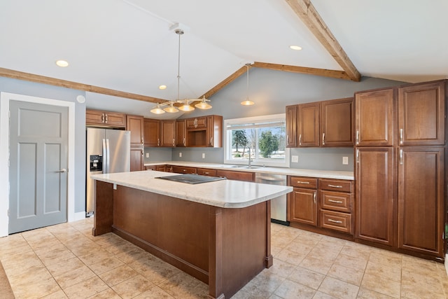 kitchen featuring lofted ceiling with beams, a kitchen island, appliances with stainless steel finishes, brown cabinets, and pendant lighting