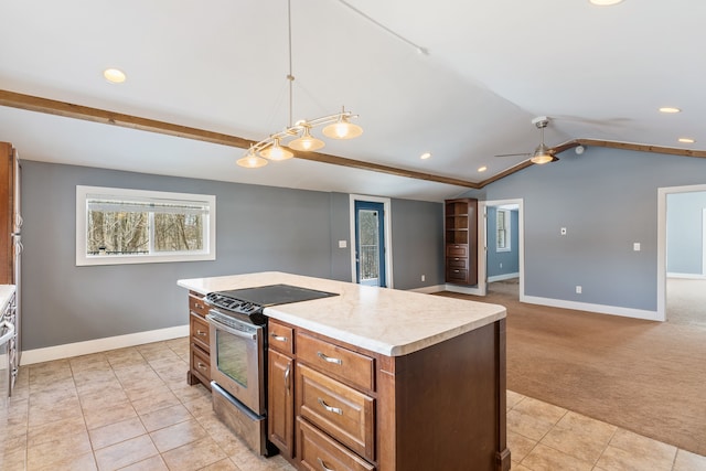 kitchen with a kitchen island, open floor plan, hanging light fixtures, stainless steel electric range, and light countertops