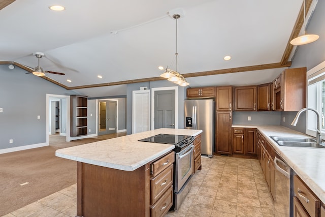 kitchen with brown cabinetry, a kitchen island, stainless steel appliances, light countertops, and a sink