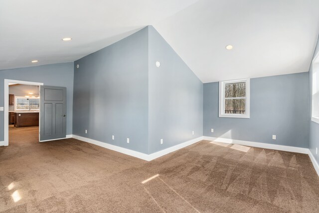 additional living space with carpet floors, recessed lighting, baseboards, and lofted ceiling