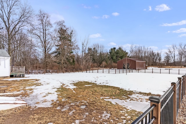 yard layered in snow with fence