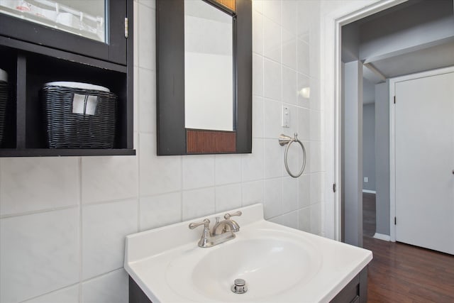 bathroom featuring tile walls and vanity