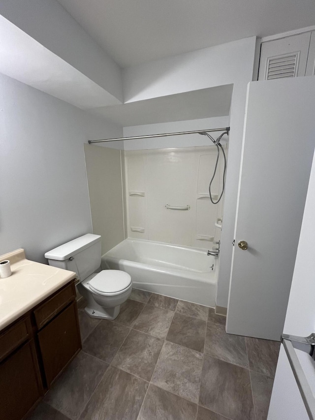 bathroom featuring toilet, washtub / shower combination, and vanity