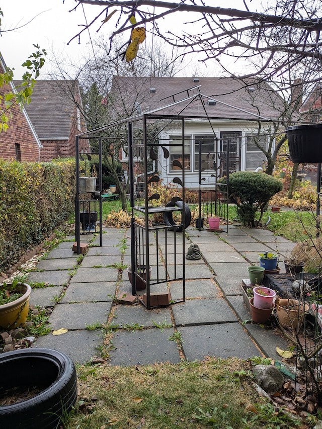 view of patio / terrace featuring fence and a gate