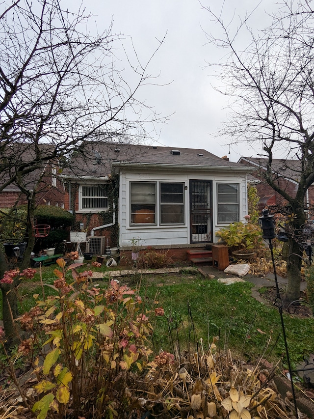 rear view of house with central AC