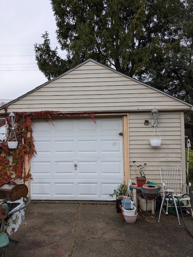 garage with concrete driveway