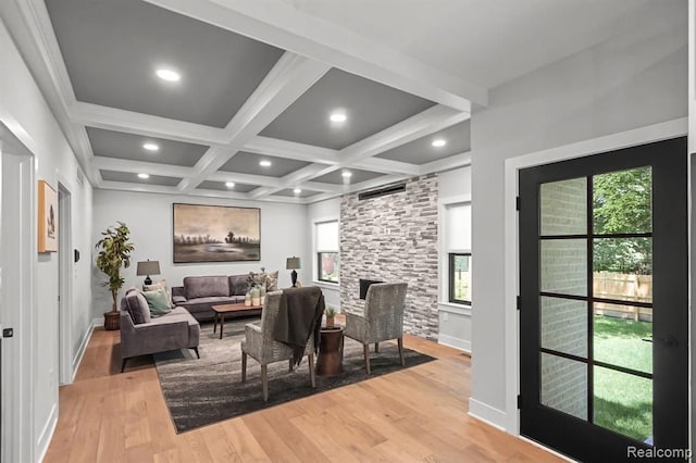 dining area featuring beamed ceiling, coffered ceiling, light wood-style flooring, and recessed lighting