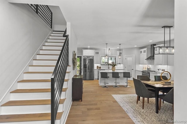 interior space with stairs, light wood-type flooring, and recessed lighting