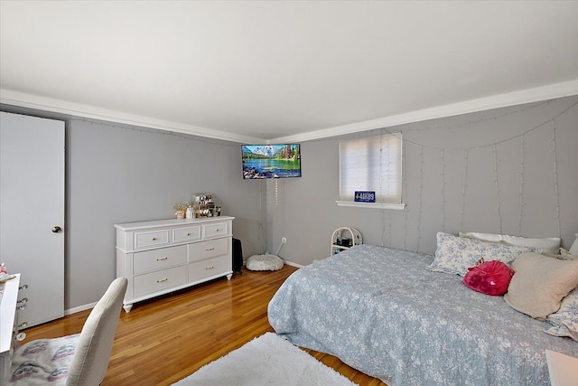 bedroom featuring light wood-style floors