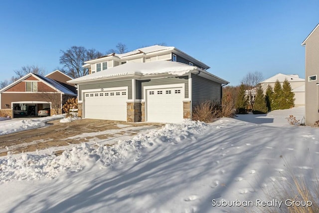 view of front of house featuring a garage and stone siding