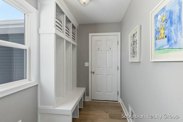 mudroom with light wood-type flooring and baseboards