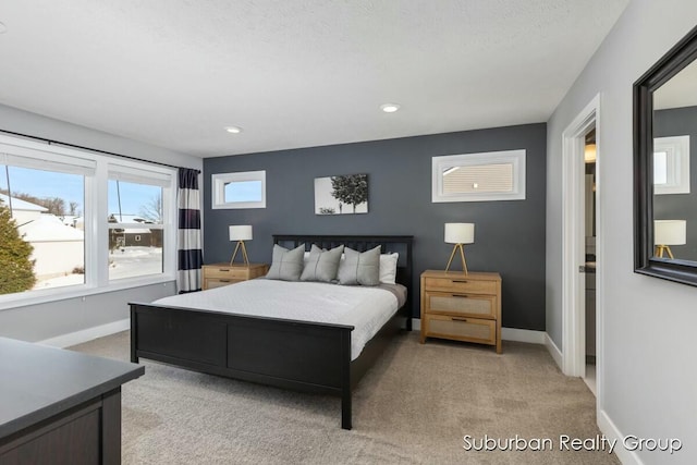 bedroom featuring light carpet, baseboards, and recessed lighting