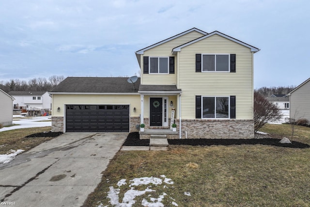 traditional-style home featuring concrete driveway, brick siding, an attached garage, and a front yard