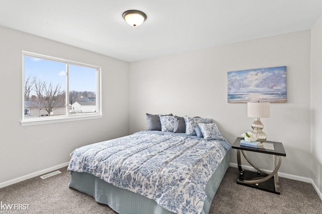 bedroom with visible vents, baseboards, and carpet flooring