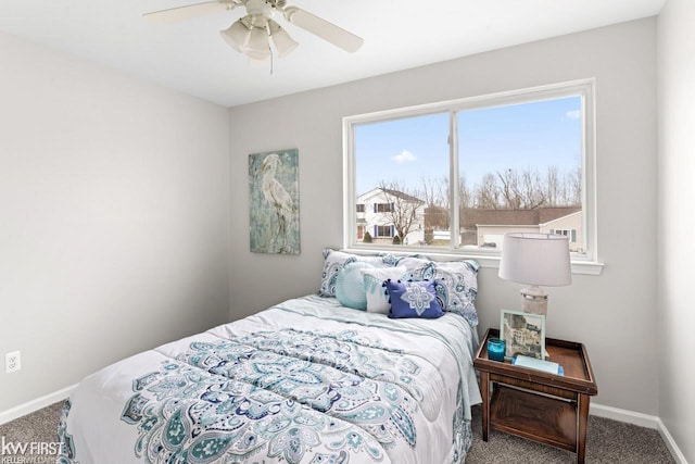 carpeted bedroom featuring ceiling fan and baseboards