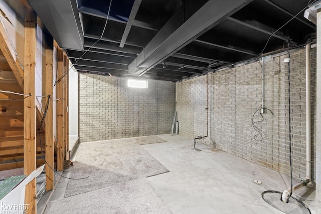 unfinished basement with brick wall