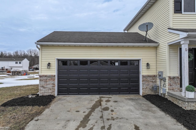 garage with concrete driveway