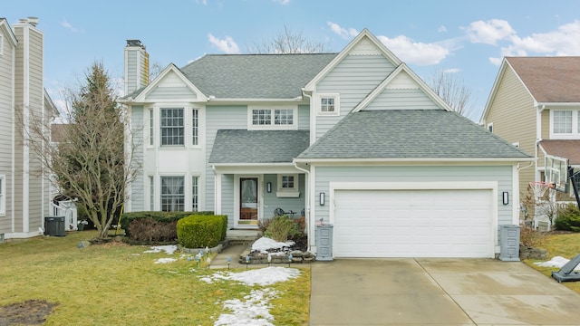 view of front of property featuring driveway, a garage, a shingled roof, a chimney, and a front lawn