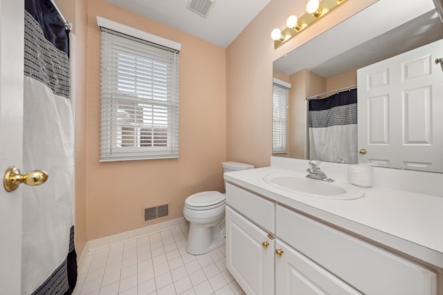 bathroom with toilet, tile patterned flooring, visible vents, and baseboards