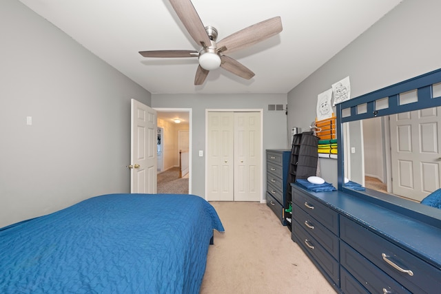 bedroom featuring ceiling fan, visible vents, and light colored carpet