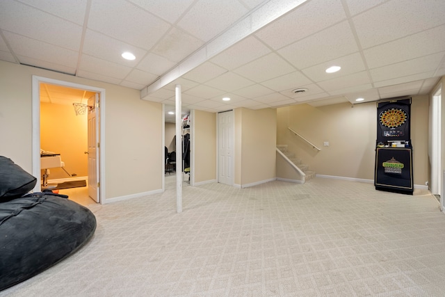 finished below grade area featuring carpet, stairs, baseboards, and recessed lighting