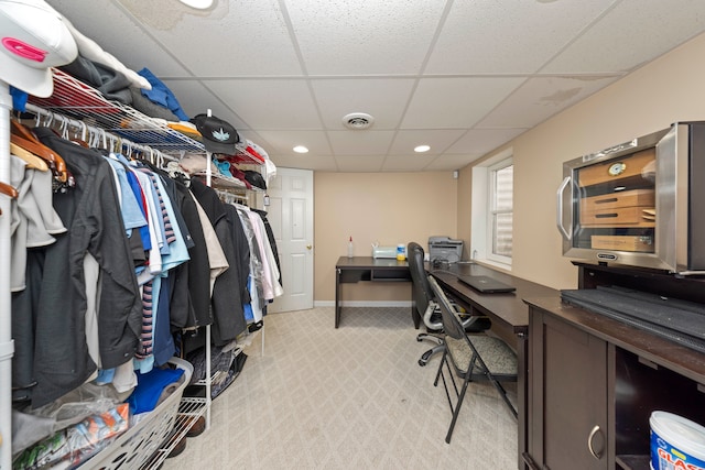 home office featuring a paneled ceiling, recessed lighting, visible vents, light carpet, and baseboards