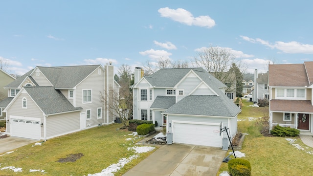 view of front of house featuring driveway, a shingled roof, a front yard, and a residential view