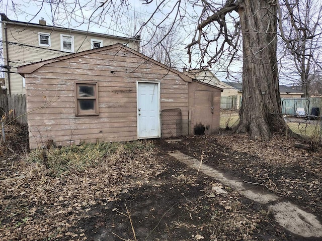 rear view of house with fence