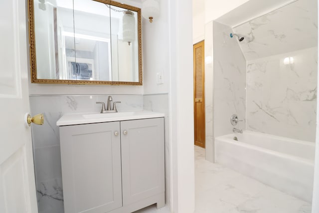 bathroom featuring marble finish floor, shower / washtub combination, a closet, and vanity