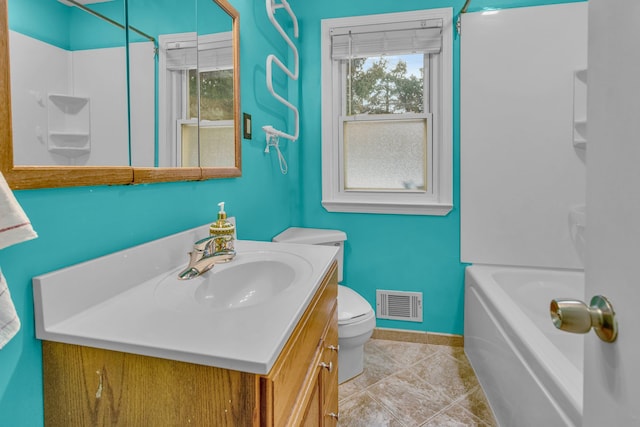 bathroom with visible vents, toilet, vanity, baseboards, and tile patterned floors