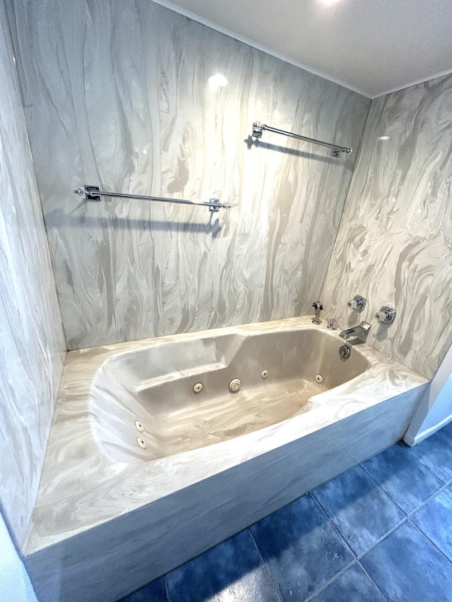 full bathroom with a jetted tub and tile patterned floors