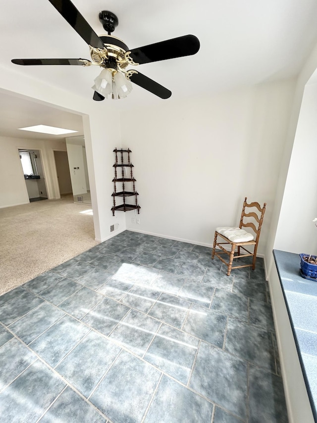 spare room with visible vents, dark carpet, and baseboards