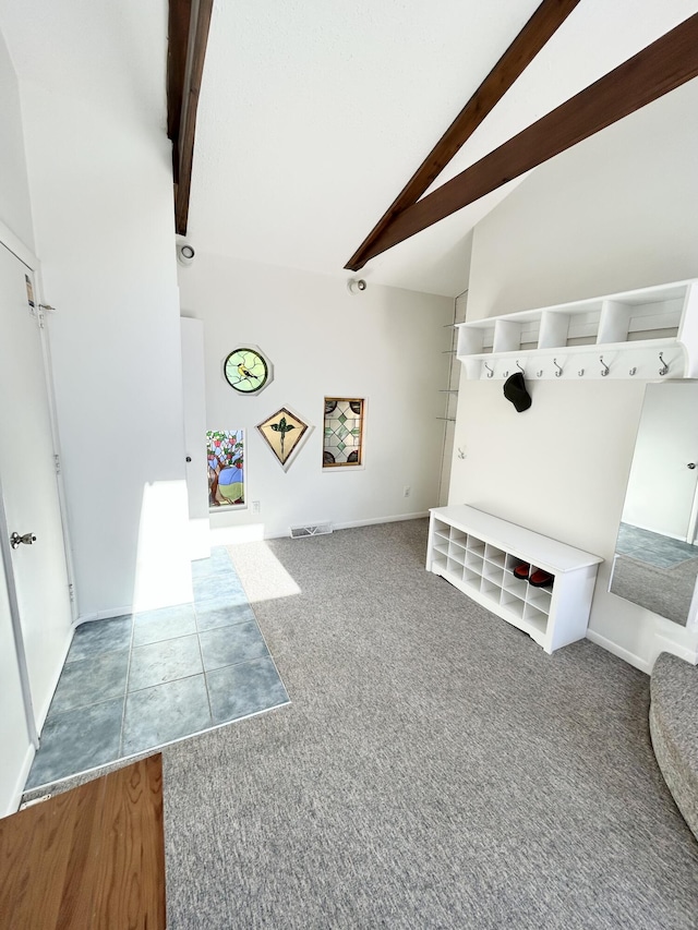 mudroom with high vaulted ceiling, beam ceiling, and carpet flooring