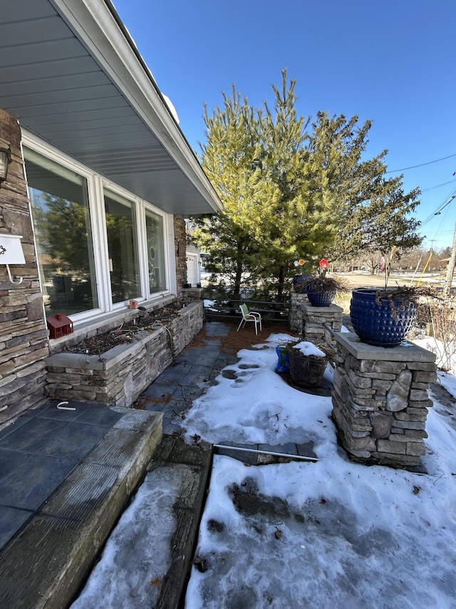 view of snow covered patio