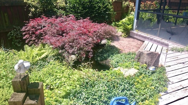 view of yard featuring fence and a patio