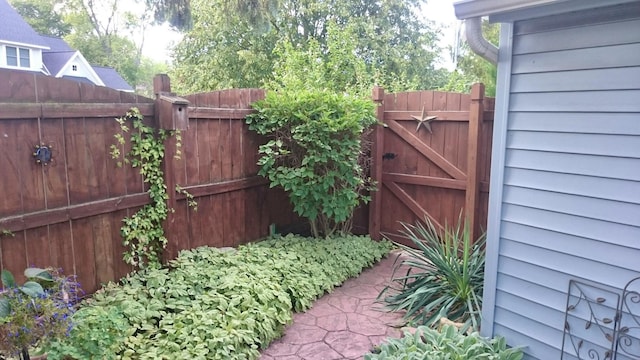 view of gate featuring fence